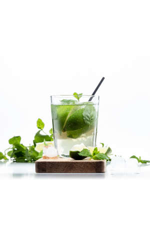 Drink of lime and mint in a glass on the tableの写真素材
