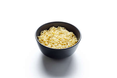 instant noodles with vegetables and eggs in a plate on the tableの写真素材