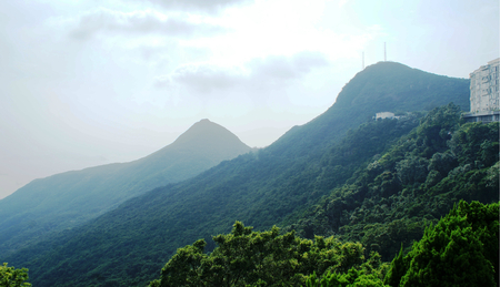 Green mountains in Hong Kong, with different peaksの写真素材