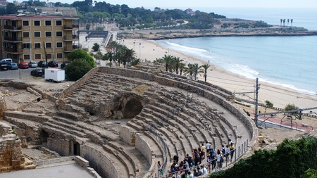 Colosseum in Tarragona, sandy beach and the seaの写真素材
