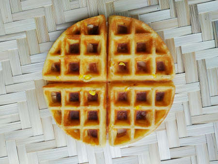 Honeycomb candy on woven bamboo patternの写真素材