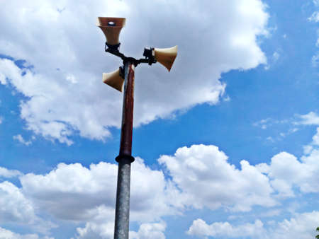 Blue sky clouds background and loudspeaker tower.の写真素材