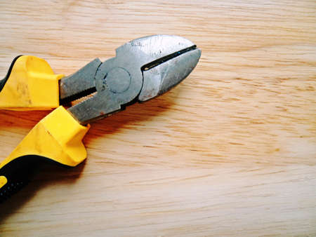 Nippers worker equipment on wooden background