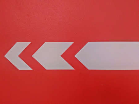 Turn left arrow on orange wall background