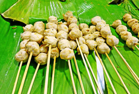 Pork ball with skewer on banana leafの写真素材
