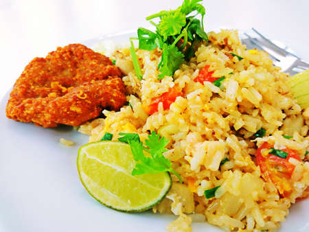 Thai Food Fried rice with lemon sliced and vegetables.の写真素材