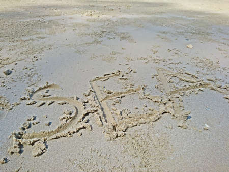 Write the word sea on the sand at the beachの写真素材