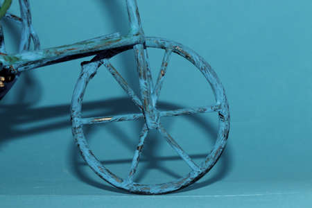 An old wheelbarrow in blue on a blue background. High quality.の写真素材