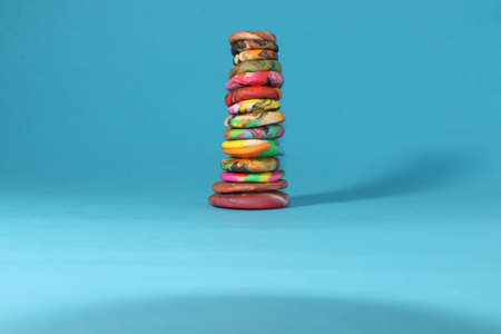 colorful plasticine tower on a blue backgroundの写真素材