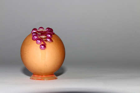 leaked egg with a hole decorated on a white background