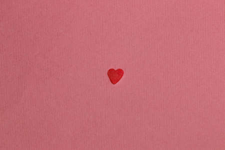 little red heart on a pink background