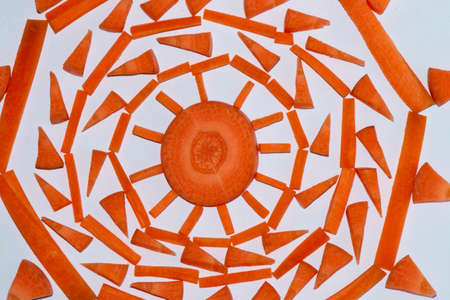 creative arrangement of chopped carrots on a white background