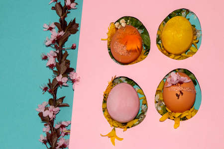 pink template with four eggs filled with flowers and colorful decorated eggs, next to branches with...
