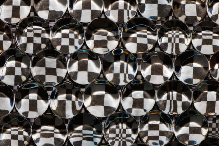 black and white abstract background, reflection of black and white tiles through beads each looks different, creative art background, modern trend ideaの写真素材