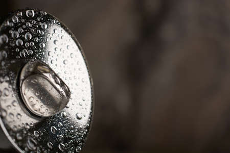Door handle with water drops macro.