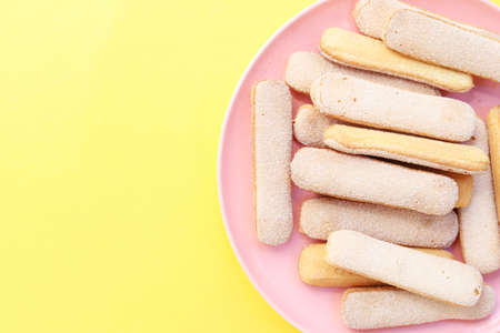 Lady finger biscuits on a plate.