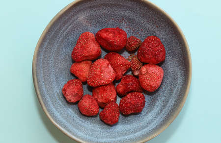 Freeze dried strawberry in a bowl.の写真素材