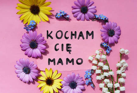 Piece of paper with text I love you mom in Polish.の写真素材
