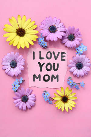 Piece of paper with text I love you mom.の写真素材