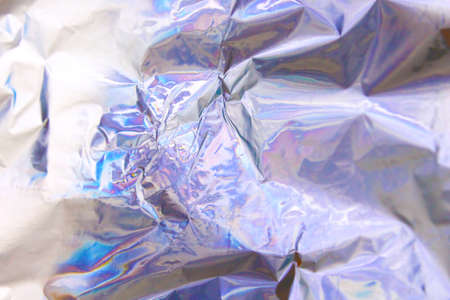 Holographic iridescent foil texture background. It can be used for posters, cards, flyers, brochures, magazines and any kind of cover. eps 10の写真素材