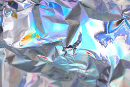 Holographic iridescent foil texture background. It can be used for posters, cards, flyers, brochures, magazines and any kind of cover. eps 10の写真素材