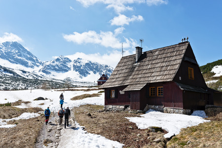 Photography in the mountains in winter. Beautiful blue sky and mountains in the snow. The road, Which roam the people. House in the snow.の写真素材