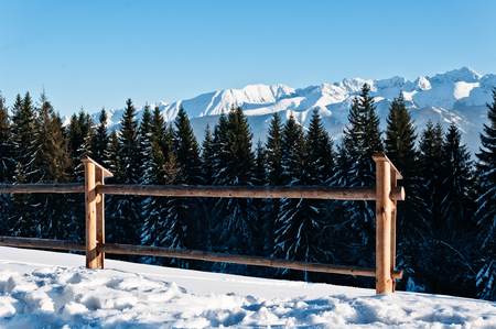 Photography in the mountains in winter. Beautiful blue sky and mountains in the snow. The road, Which roam the people.の写真素材