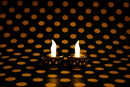 Led candles on dotted backgroundの写真素材