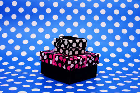 Gift boxes on blue dotted backgroundの写真素材