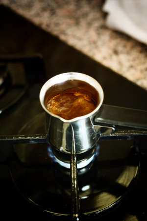 Cooking turkish coffee in potの写真素材