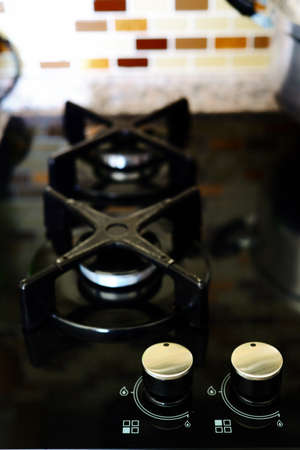 Black contemporary oven in kitchenの写真素材