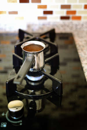 Cooking turkish coffee in potの写真素材