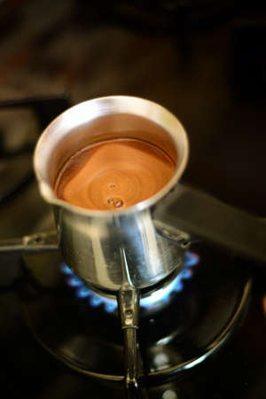 Cooking turkish coffee in potの写真素材