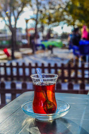 Hot turkish tea in traditional tea glass outdoorsの写真素材