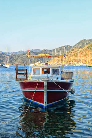 Small fisher boat at seasideの写真素材