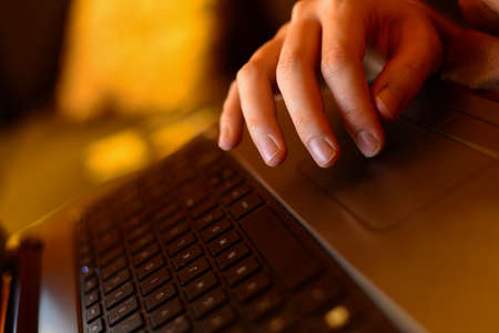 Hand on laptop touchpad business conceptの写真素材