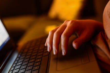 Hand on laptop touchpad business conceptの写真素材