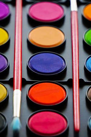 Water color paints and brushes close upの写真素材