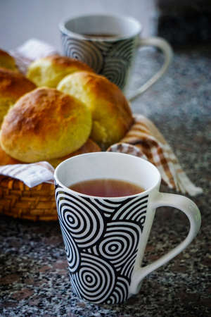 Home made bread and tea in the mugの写真素材