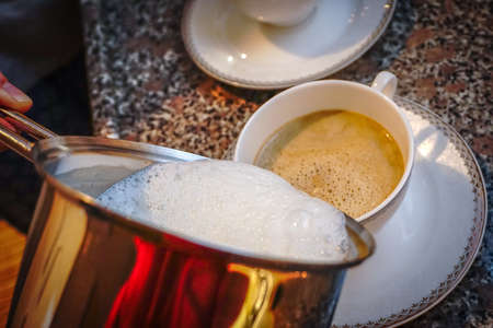 Flat White Coffee preparation at homeの写真素材