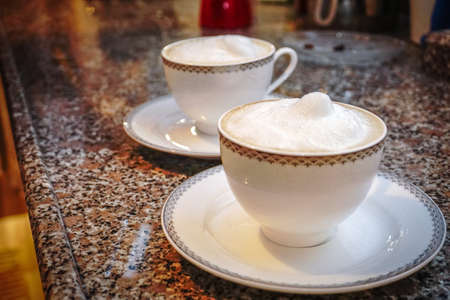 Flat White Coffee preparation at homeの写真素材