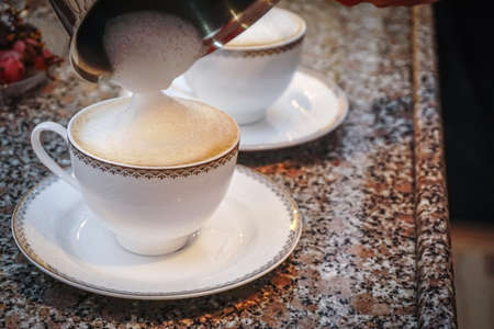 Flat White Coffee preparation at homeの写真素材