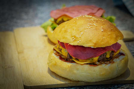 Preparing homemade fresh juicy burger close up viewの写真素材