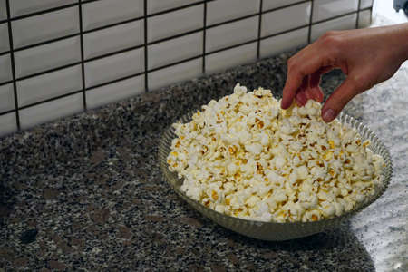 Eating homemade freshly made popcorn close up viewの写真素材