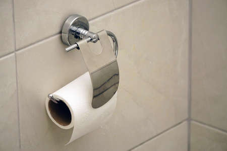 White toilet paper roll on white isolated backgroundの写真素材