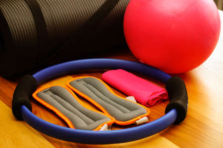 Pilates set with foot weighs stretch ball and mat at homeの写真素材