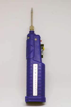 Battery powered soldering iron on white isolated backgroundの写真素材