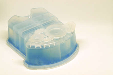 Men shaver cleaning solution cartridge on white isolated backgroundの写真素材