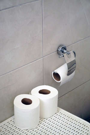 White toilet paper roll on white isolated backgroundの写真素材