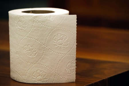 Toilet paper on wooden backgroundの写真素材